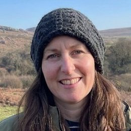 Anna on the moor in winter, in a wool hat.